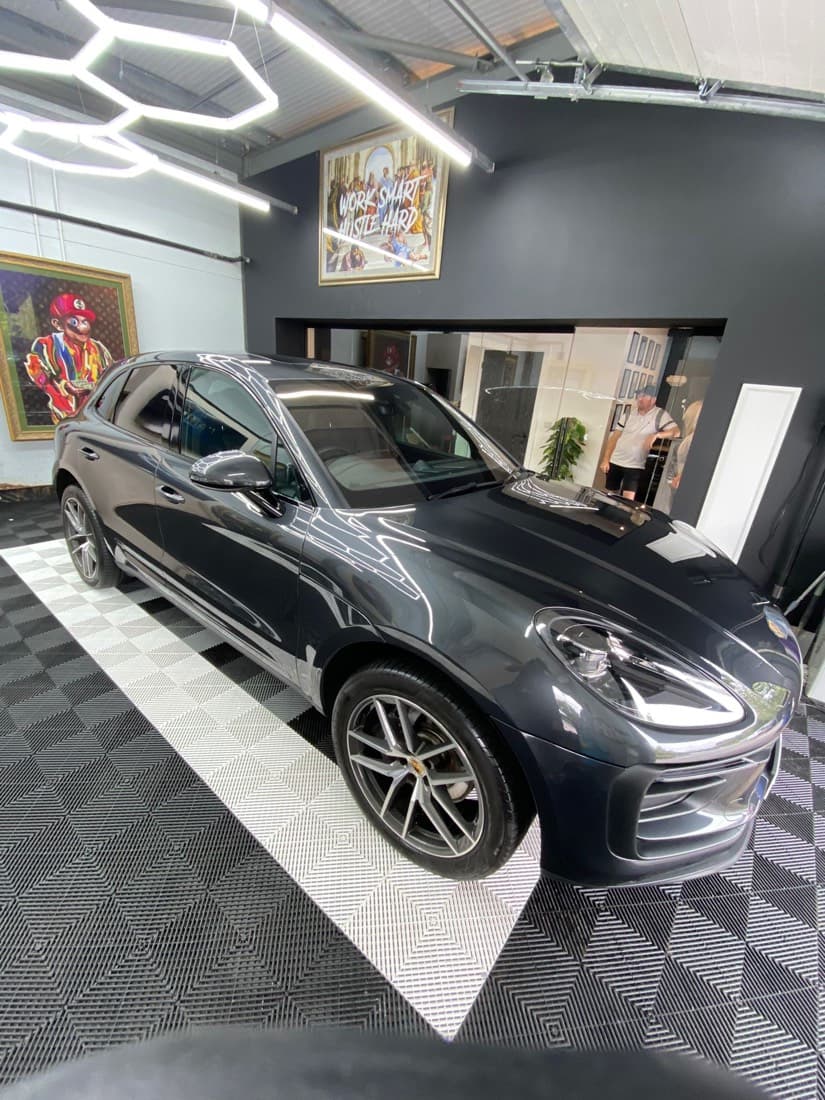 Porsche Macan detailed under the studio lights at The Valet Club, Bristol